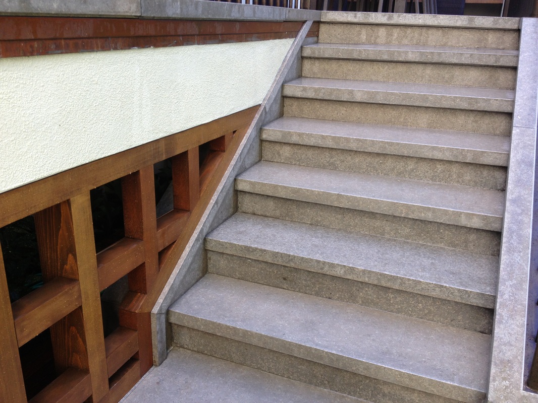 Cast stone staircase with wood detail